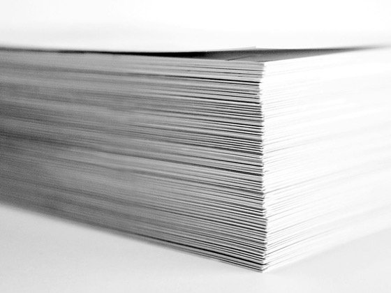 Close-up of a stack of paper, in black and white