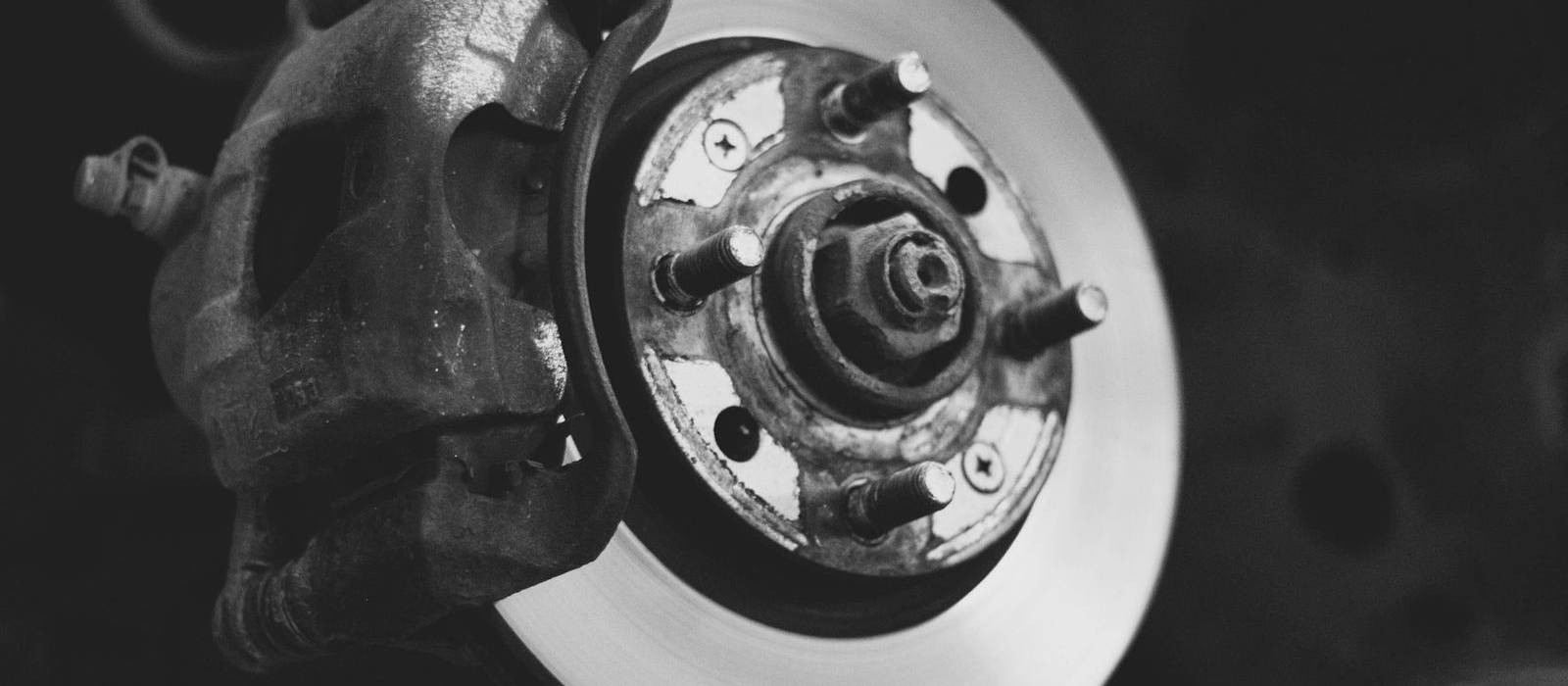 Close-up of a brake disc and calliper with the wheel off